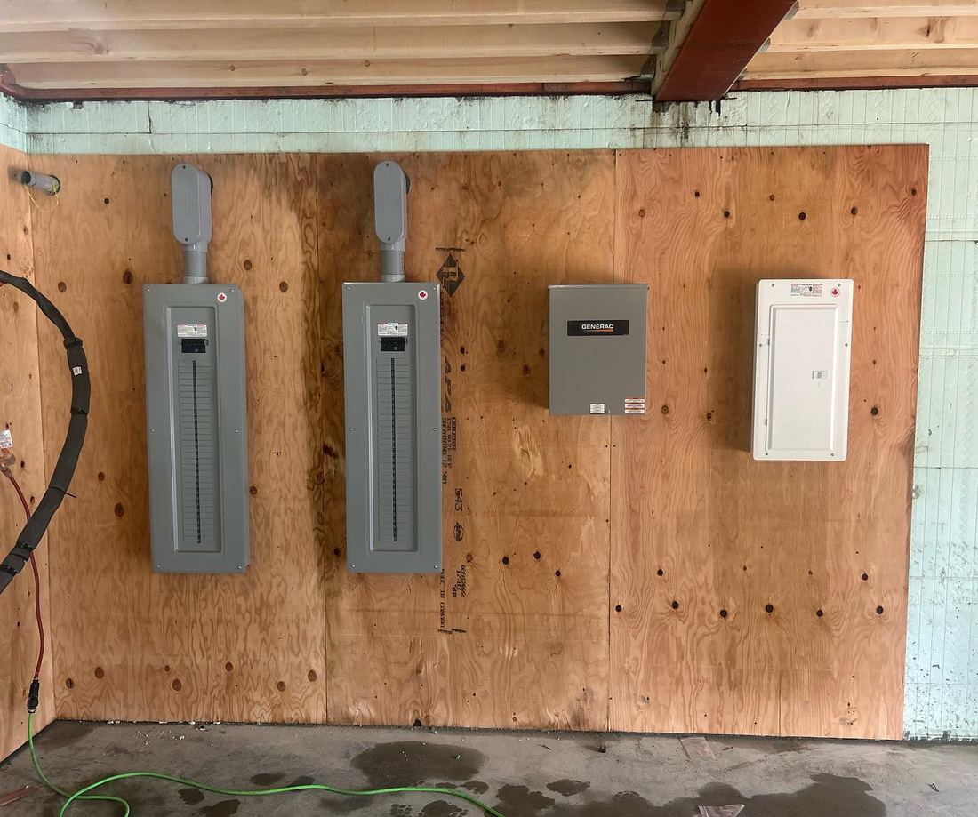 Panels and disconnect on a plywood wall feeding shop equipment